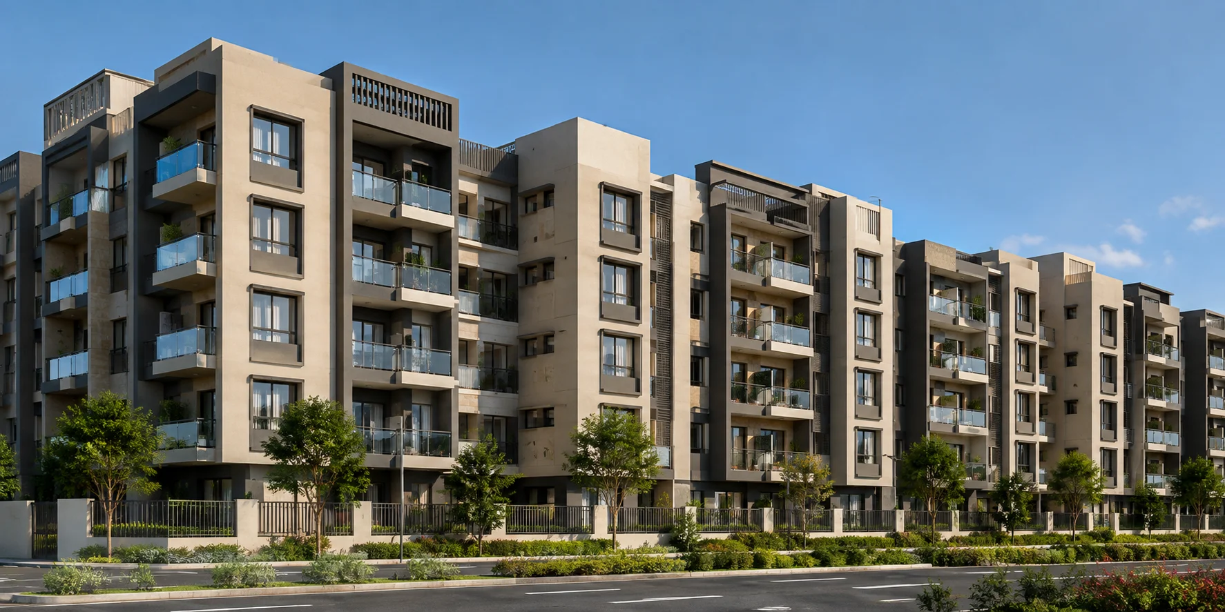 Modern residential apartment building with landscaped surroundings Modern apartment building with balconies, landscaped garden, and clear blue sky